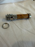 Aluminum uplocking fly reel seat in bright nickel with a light Burl insert